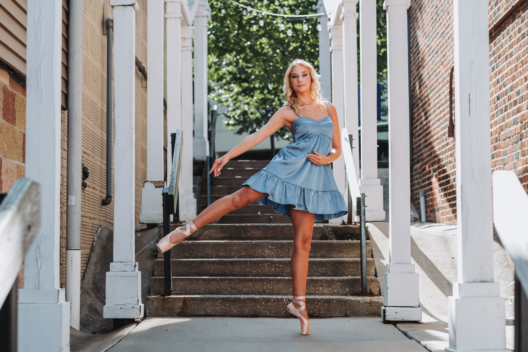 Senior portrait of a ballerina on downtown steps
