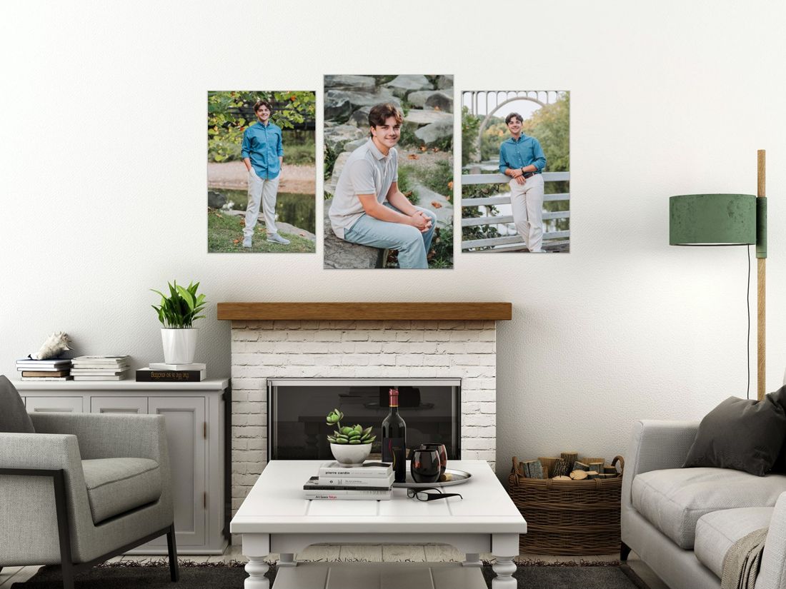 Three senior portraits hung as a wall art collection above a fireplace